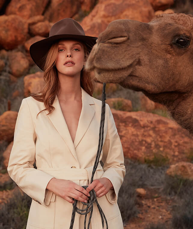 R.M.Williams cream short suit and Akubra hat with camel escort R.M.Williams cream short suit and Akubra hat with camel escort