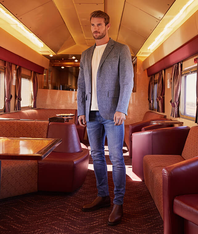 R.M.Williams jacket, denim and Craftsman in the lounge on The Ghan R.M.Williams jacket, denim and Craftsman in the lounge on The Ghan