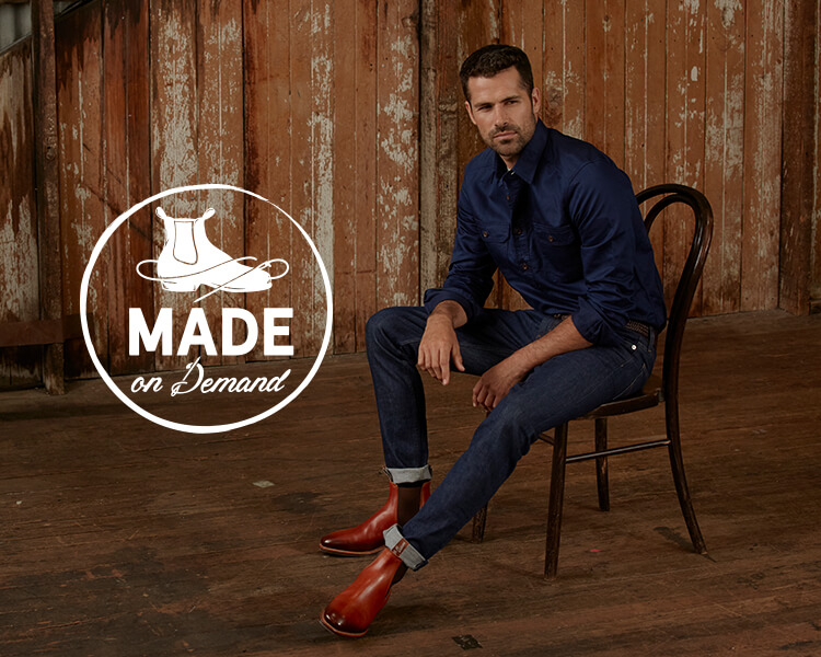 R.M.Williams Made On Demand Burnish Craftsman Made on Demand him sitting wearing Burnish boot